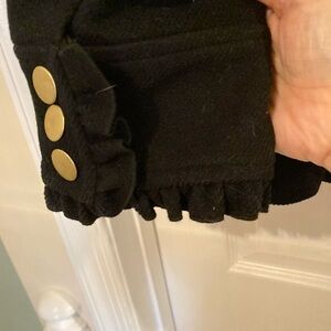 Stunning Black Wool over coat. Ruffled sleeve and pockets. NWT.